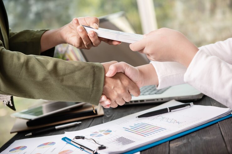 business-people-shaking-hands-finishing-up-meeting_1150-37745.jpg
